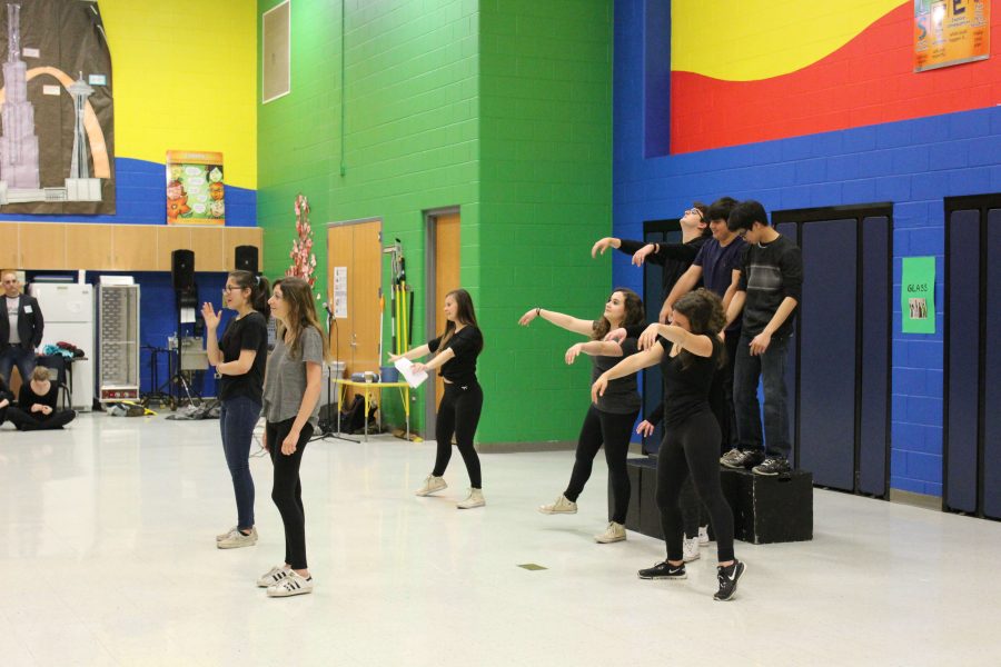 LHS Theater members perform some presentational theater, a monologue, while the rest of the performers act as “mummies” in the story performed for Oak Grove students. Later, they discussed all of LHS's opportunities to participate in theater and acting.
