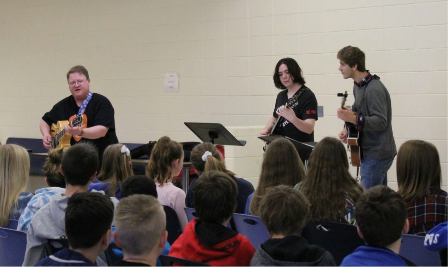 LHS guitar teacher Mr. David Ness and guitar students Thomas Power and Luke Christensen performed songs such as “Sweet Home Chicago” and “Johnny B. Goode” for Oak Grove students in the junior high cafeteria, where students enjoyed the performance and clapped their hands to the beat. Mr. Ness also talked with students about the blues and Jazz Appreciation Month. He discussed the many opportunities LHS offers for students who want to play guitar, such as the guitar classes, Guitar Club and the Jazz Band.