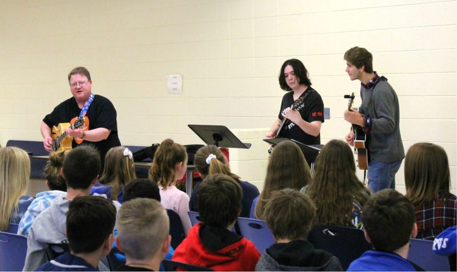 LHS guitar teacher Mr. David Ness and guitar students Thomas Power and Luke Christensen performed songs such as “Sweet Home Chicago” and “Johnny B. Goode” for Oak Grove students in the junior high cafeteria, where students enjoyed the performance and clapped their hands to the beat. Mr. Ness also talked with students about the blues as well as Jazz Appreciation Month. He discussed the many opportunities LHS offers for students who want to play guitar, such as the guitar classes, Guitar Club and the Jazz Band.