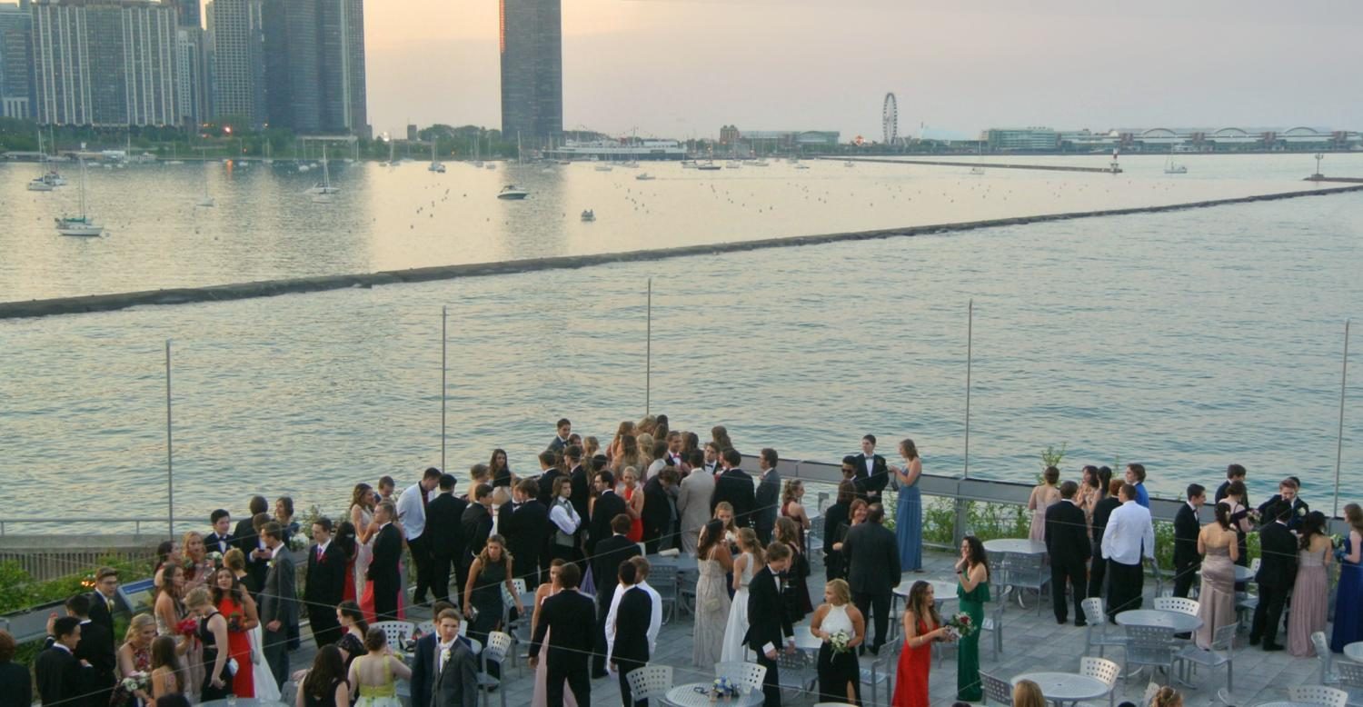 Before dinner, students and chaperones meet at the deck outside of the Shedd Aquarium to view the city skyline, chat and take pictures. 