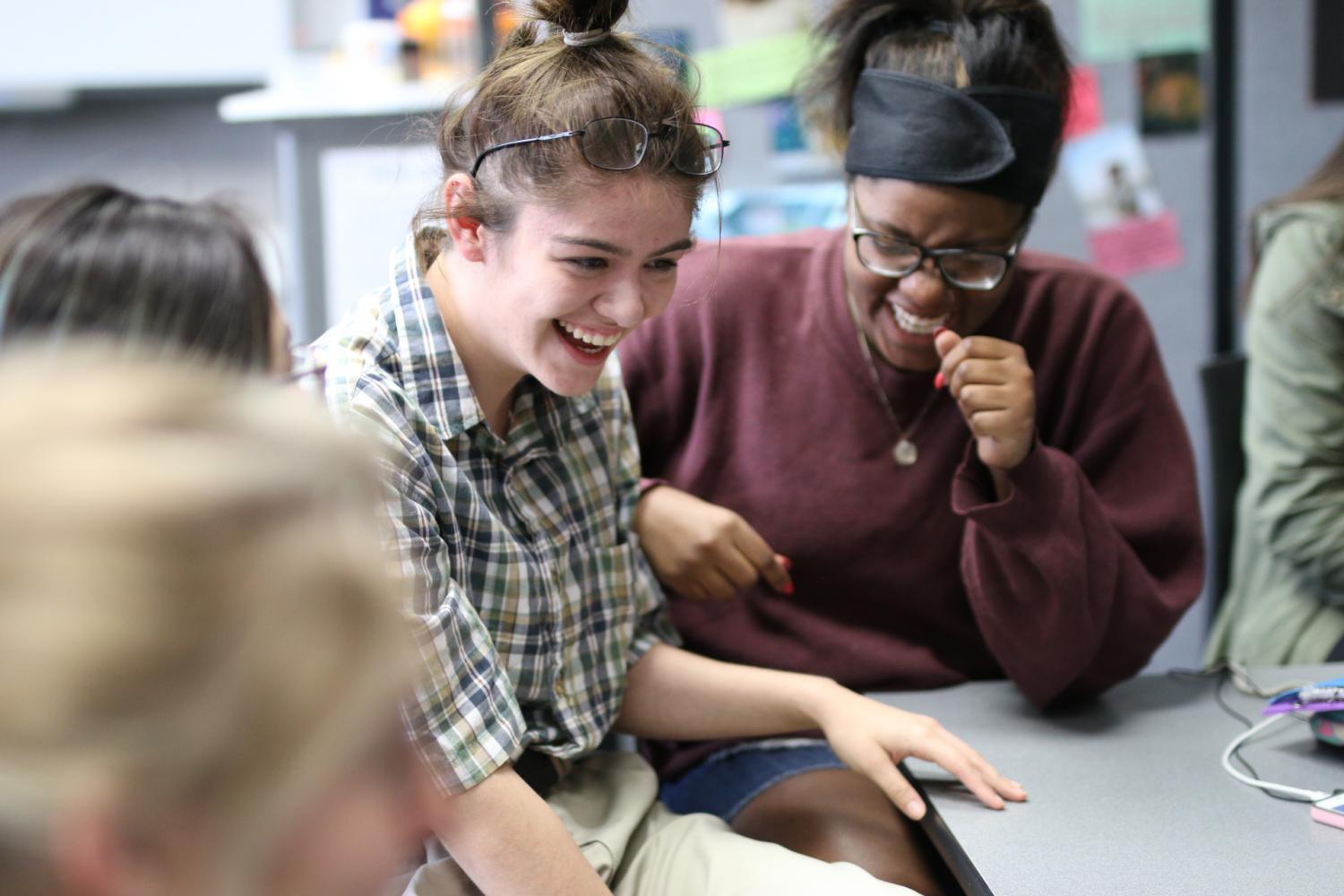 At a recent LHS United meeting, seniors Jennifer Graham Leal and Jaimee Johnson, an LHS United board member, share a laugh while discussing how to raise awareness and celebrate diversity at LHS.