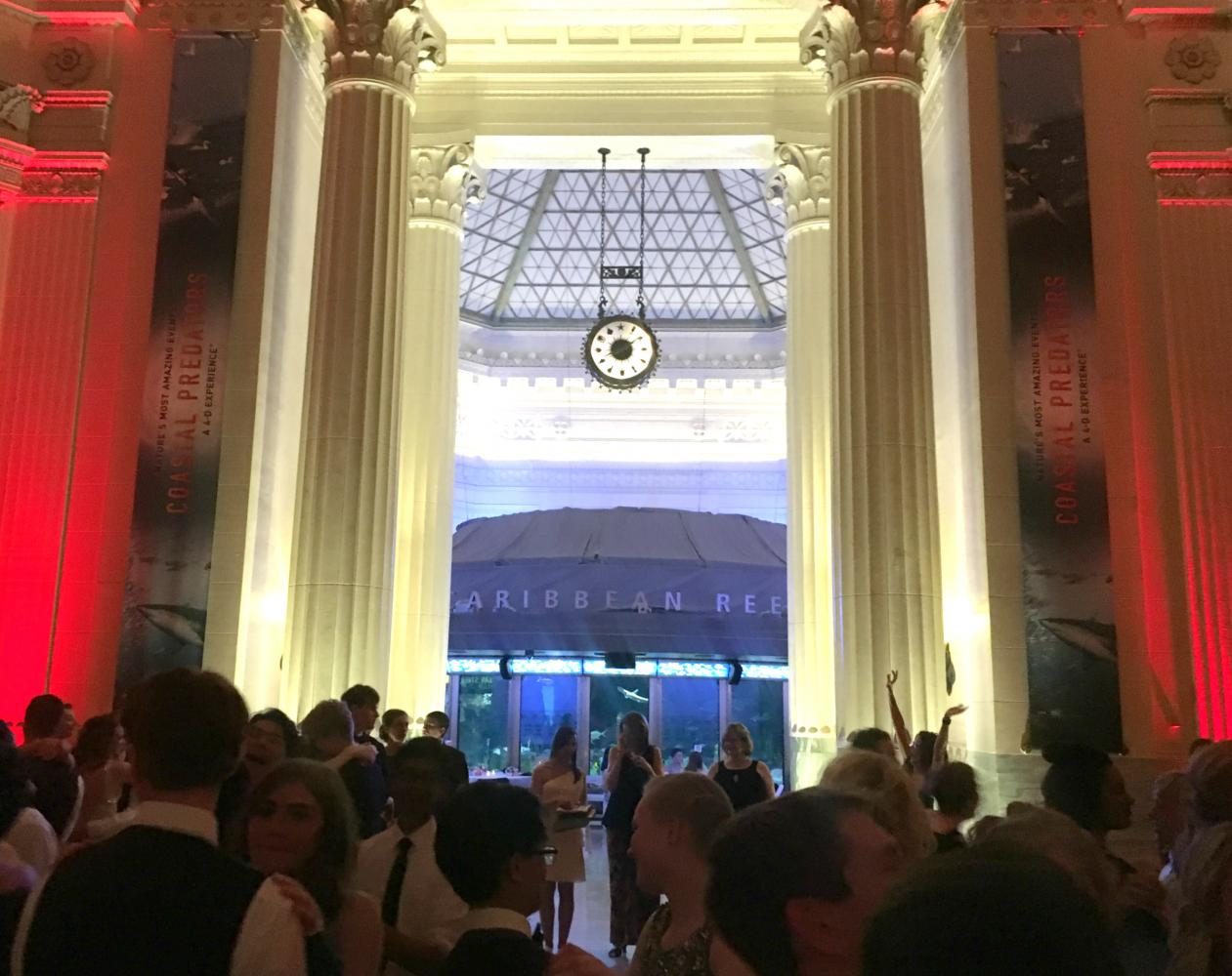 Students dance in the Kovler Family Hall after eating dinner and viewing the Caribbean Reef.