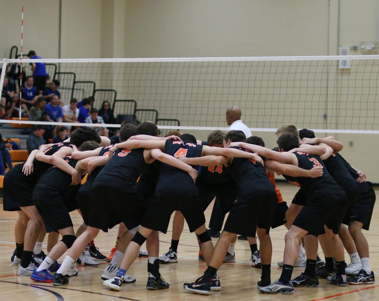 The Wildcats do their pre-game huddle before the last home game of the season.