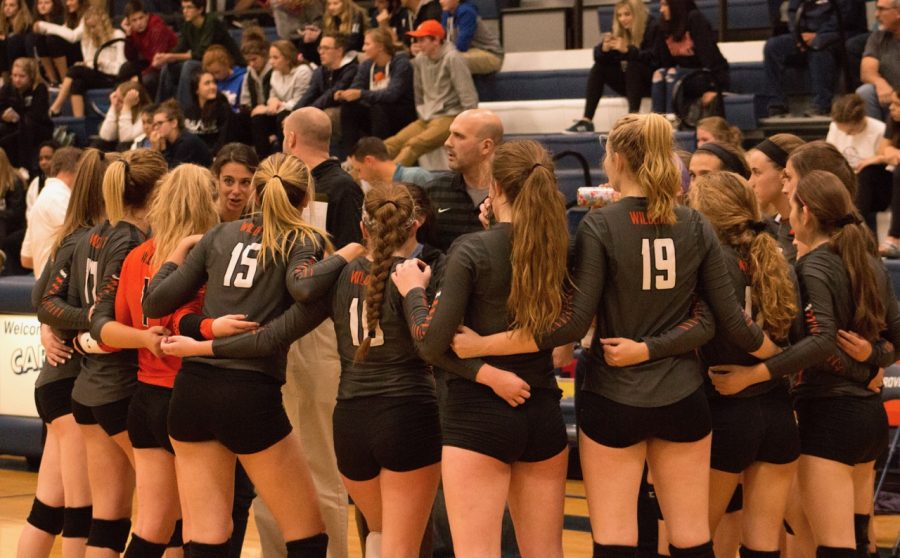 Coaches Jennifer Smith and Greg Loika give the team feedback during a timeout in the second games.