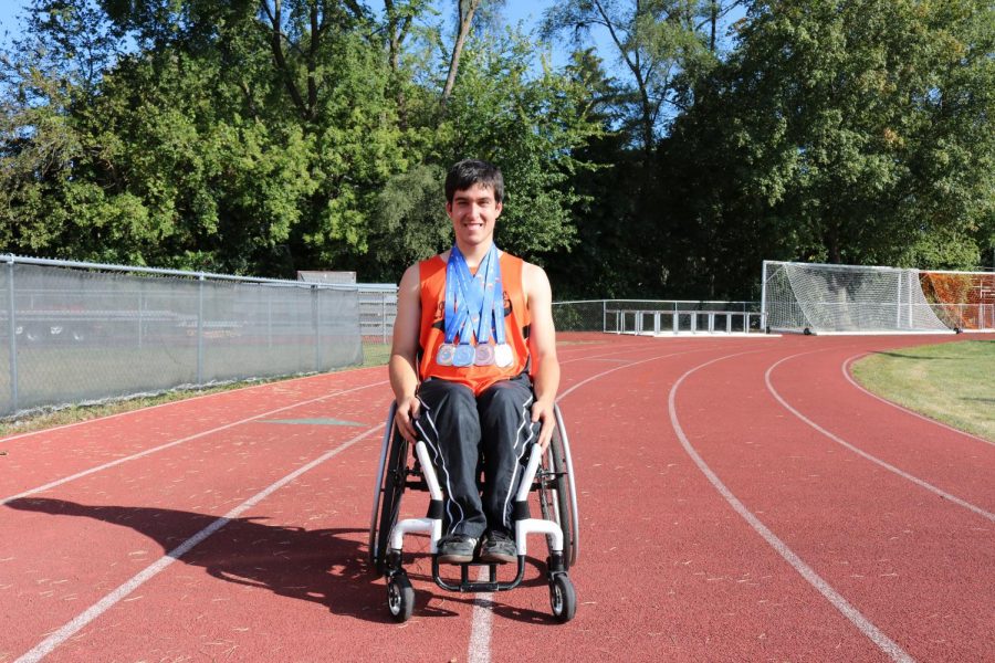 Burkhart, in his LHS track uniform, wears medals from his competition in Prague, Czech Republic in 2016. He won a bronze medal in the 100-meter race and silver medals in the 200-, 400- and 800-meter races.