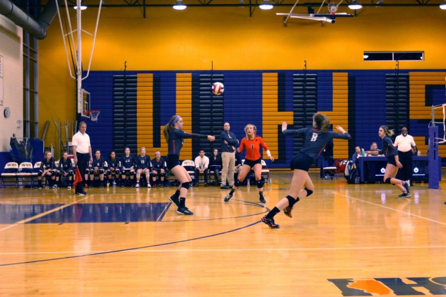 Seniors Morgan Degregor (1) and Kailey Christianson (8) prepare for a pass from teammate Kellie Hopper. 