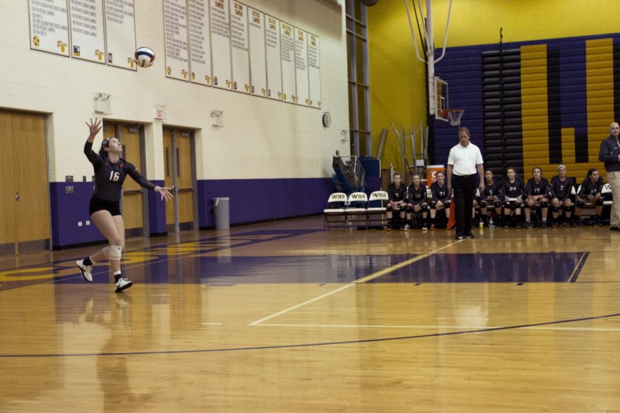 Junior Jen Formica serves the ball at the beginning of the second game. 