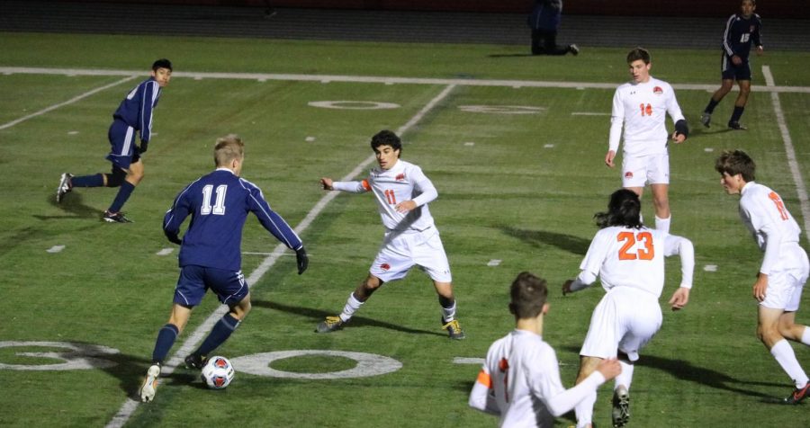 Libertyville players surround an Evanston attacker; it was another shutout for the Wildcat defense.
