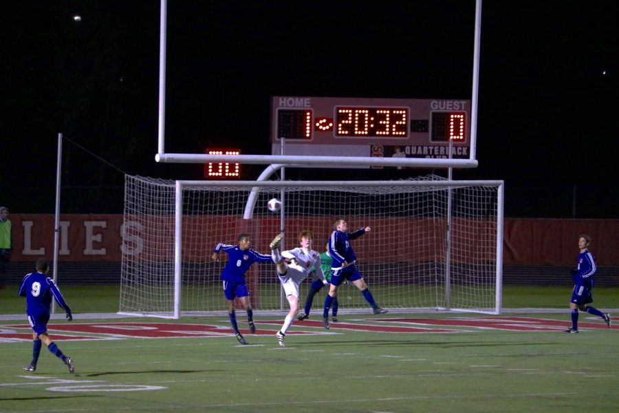 Evan Rasmussen crosses to Ryan Wittenbrink for a shot attempt.