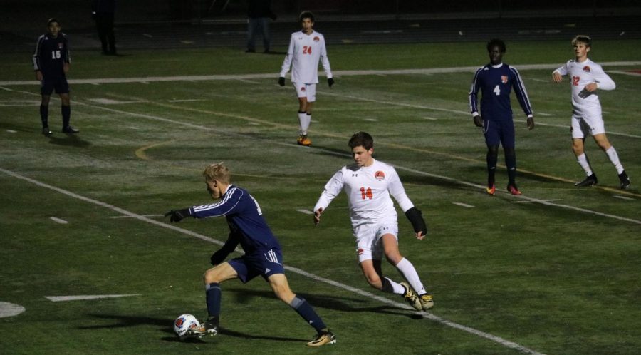 Will Powers (14) played even after suffering an injury to his left wrist, which occurred in the regional final win against Mundelein.