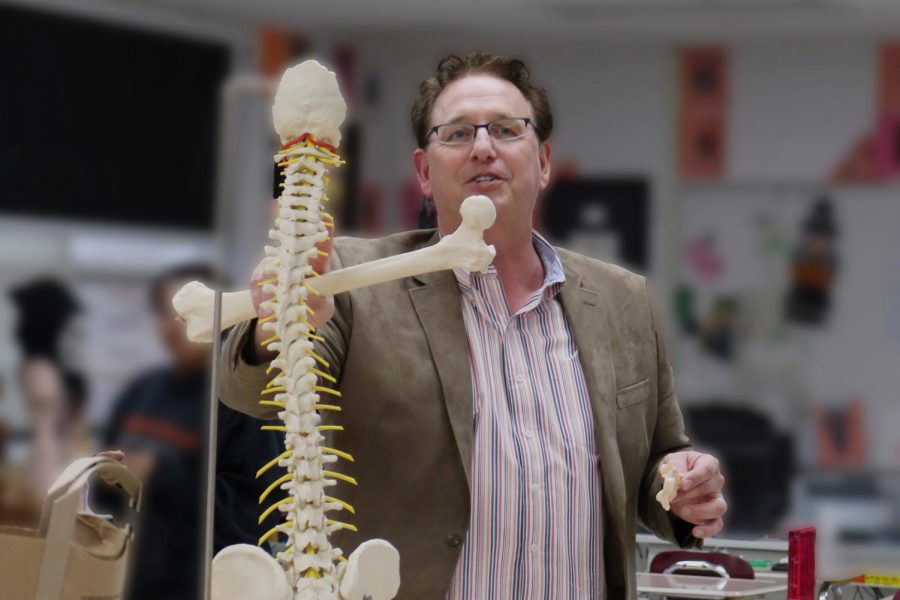 Mr. Kreutz uses models in his classes to indicate different parts of the spine.