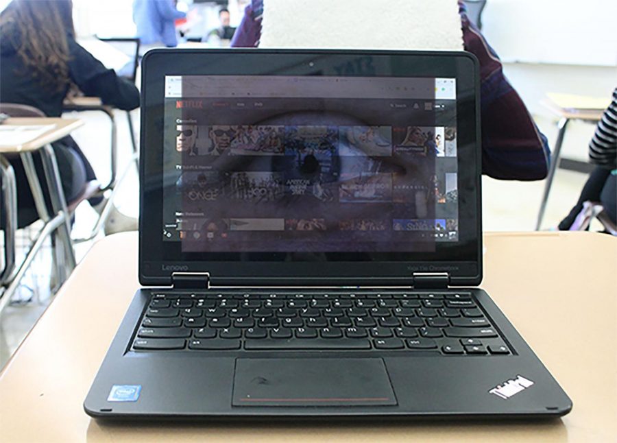 Eyes reflecting into the screen of a student's chromebook during the school day.