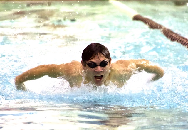 Libertyville sophomore Jonah Armenta powers through the last few strokes of his 100M butterfly, finishing with a time of 1:08.