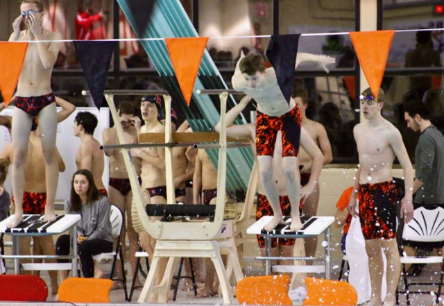 Junior Tyler Trucko prepares to dive in and swim the middle leg of his team’s 400M freestyle relay.