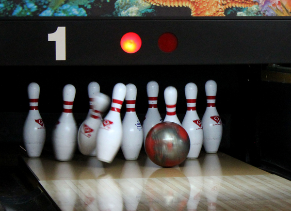 Sophomore Kailey Adams bowls a strike after the hook, a ball that curves into the pins as it approaches them.