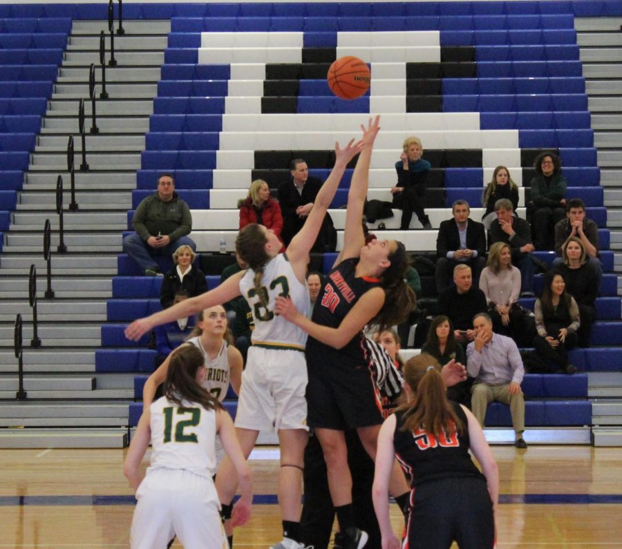 Junior+forward+Maddie+Spaulding+%2830%29+reaches+for+the+jump+ball+at+the+beginning+of+the+game%2C+which+Libertyville+received+possession+of.+Spaulding+was+the+highest+scorer+for+Libertyville%2C+with+a+total+of+10+points.