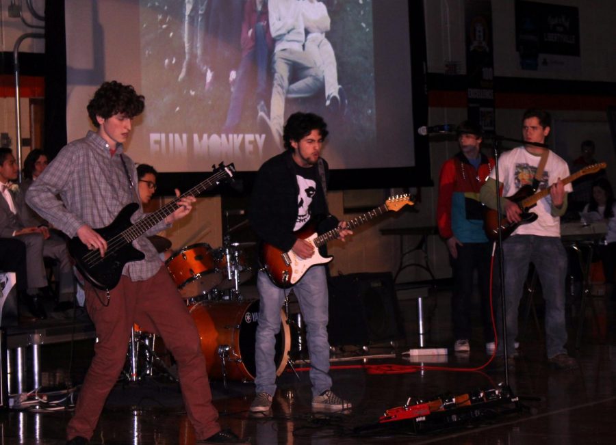 Bryce Brown-Morris, William Sun, Isaac Rodriquez, John Copeland and Brice Boyer do their rendition of the song “Dani California” by the Red Hot Chili Peppers with their band, Fun Monkey, during the assembly. The band will be performing at another school function on Sunday, Feb. 18, as part of Caring for Cambodia’s Band Jam.