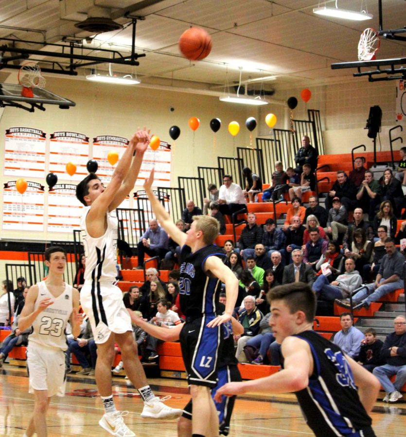 Senior Chase Eyre shoots a fadeaway against Lake Zurich’s guard Brett Hensley.