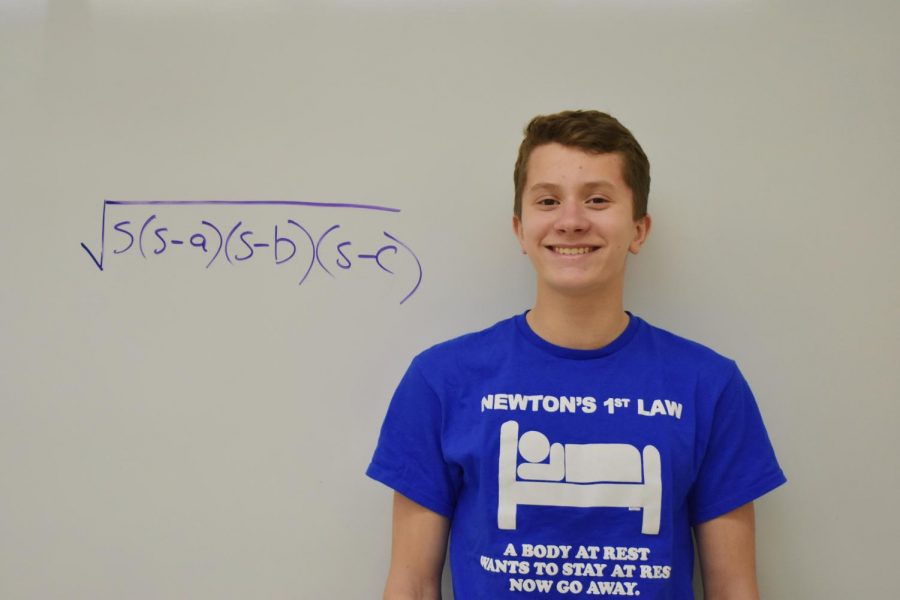 Here, Matthew is shown with his favorite mathematics formula: Herons formula.