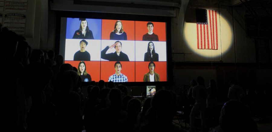 Choir teacher Dr. Jeff Brown (middle) and some choir students arranged a video of the national anthem filled with complex harmonies. This video was a surprise for the audience because, in the past, the song has generally been performed live.