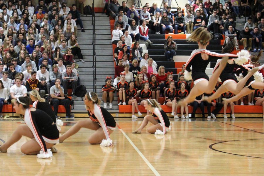 Leaping across the floor, varsity poms performed their routine to a mashup of current pop songs despite their season being over.