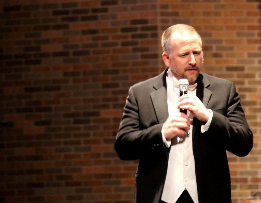 Conductor Adam Gohr thanks the audience for coming to the show and expresses how hard the wind ensemble worked on the last song of the night.