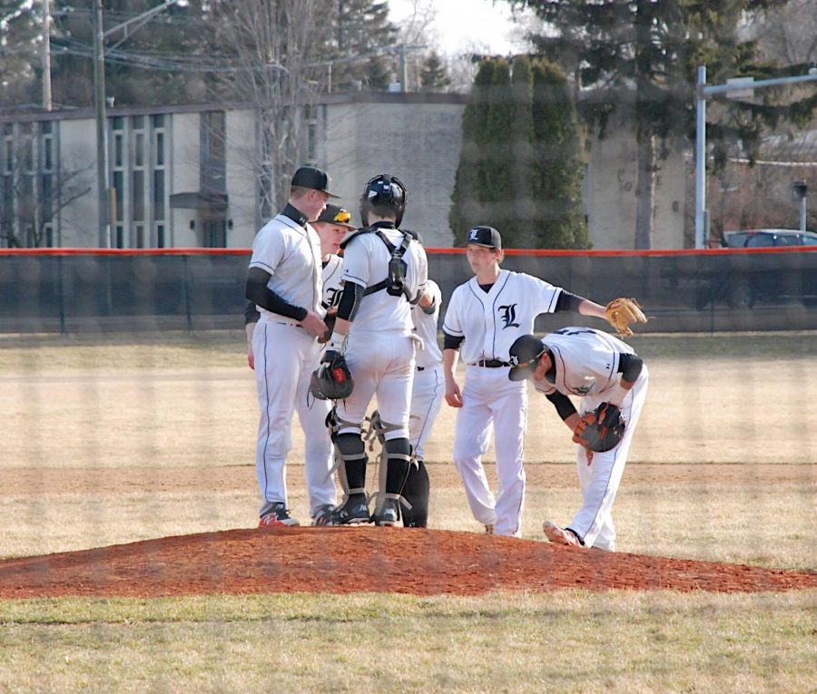 The infield meets at the mound before the start of the fifth inning.