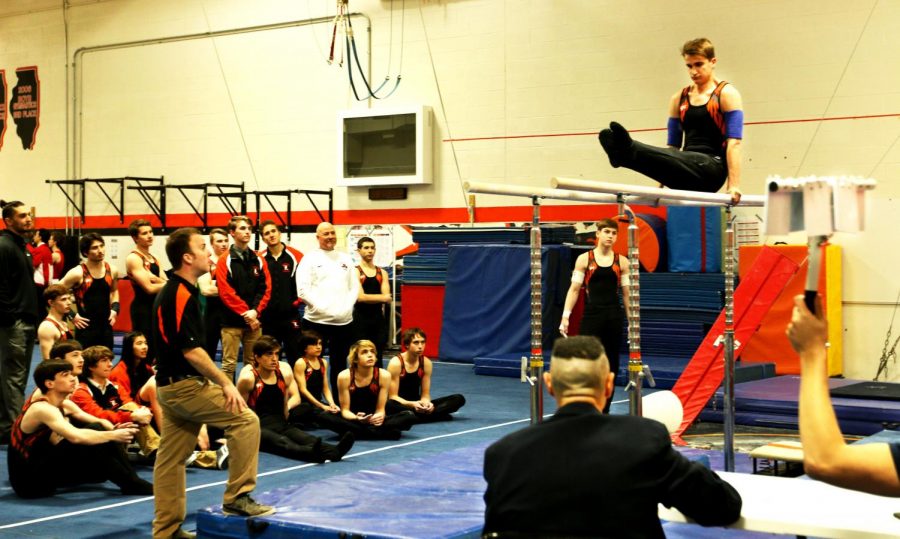 Throughout the meet, teammates watched each other’s performances and cheered them on. Gymnasts watched Werden during his performance on the parallel bars. 