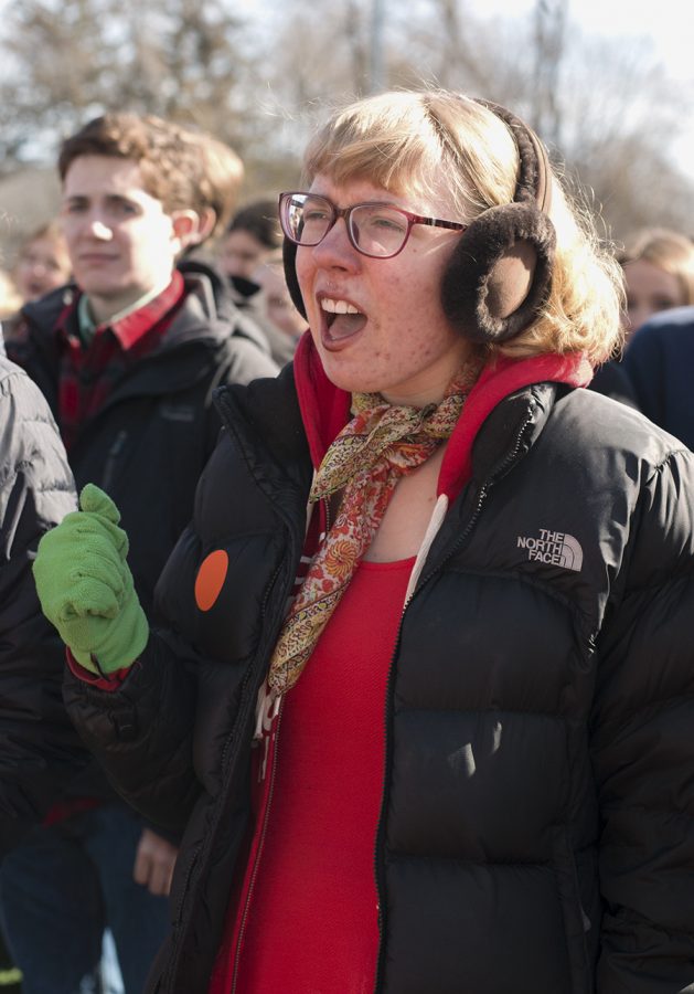 Senior Grace Kennedy raises her voice in support of one of the student speakers.