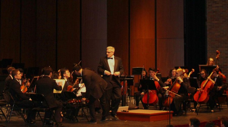 Mr. Jeremy Marino (middle) and Mr. Matthew Karnstedt (not pictured) conducted the different orchestra groups. Mr. Marino received special gifts from some seniors who were grateful for everything he had done for them in their four years at LHS.