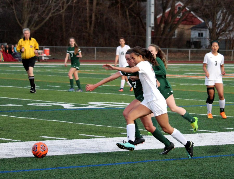 Sophomore Victoria Villanueva tussles with a Stevenson defender for the ball.