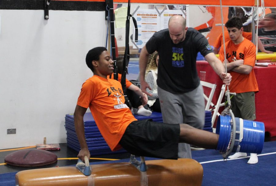 Cyrus Johnson participates in the gymnastics unit of Mr. Adam Stuart’s sophomore P.E. class. Next year, some sophomore P.E. classes will separate boys and girls during a small unit on self-defense training for girls.