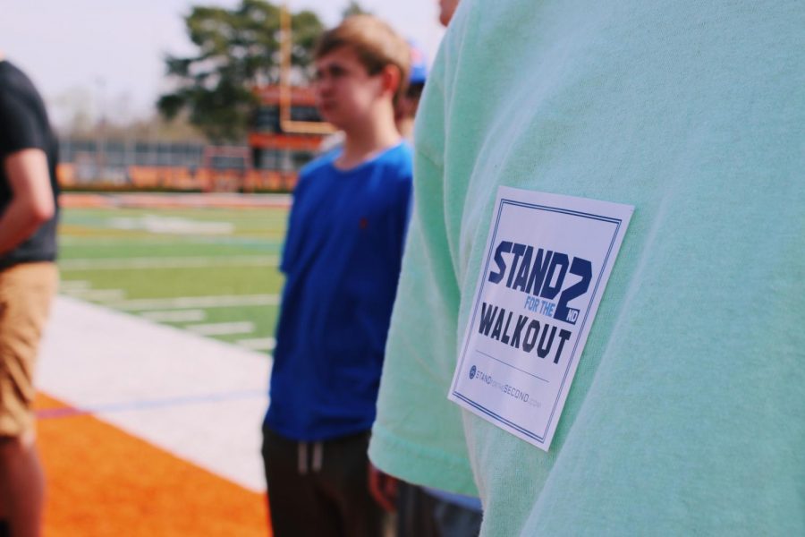 Junior Kylee Kraus passed out stickers to students that read “Stand for the 2nd Walkout.”