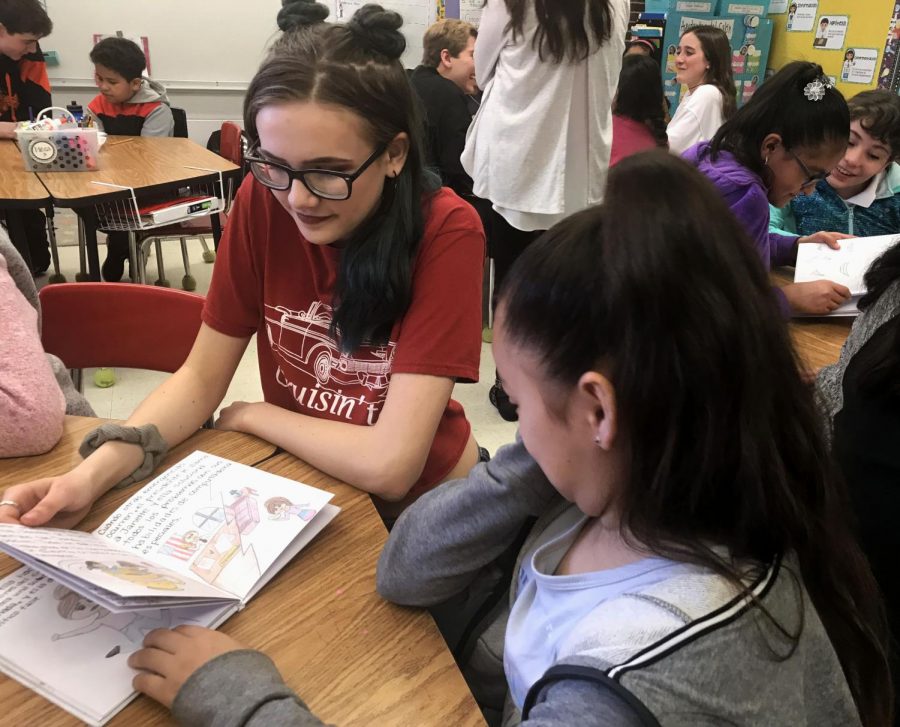 Hailey Decker, an LHS sophomore, reads the book she created for her partner, Janette.