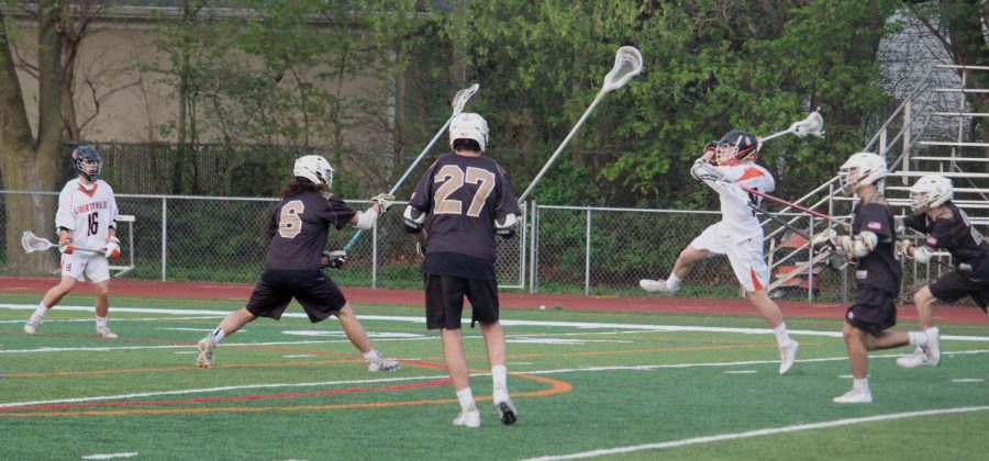 Junior Jonny Lauber launches a shot at the end of the first quarter.