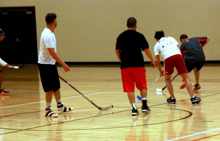 After much struggle, the white team gets possession of the ball before black quickly takes it back. 