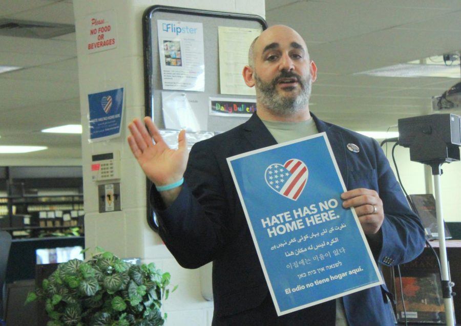 While explaining the origin behind “hate has no home here” signs, Libertyville High School teacher and theatre director Mr. Christopher Thomas spoke about the importance of acceptance and anti-hate values at LHS’s “Erase the Hate” event.