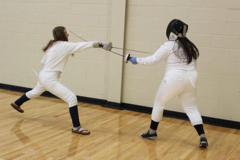 Each member of the fencing club practices one specific weapon that they prefer. Regardless of the weapon used, there are many components to their required uniform, including a mask.