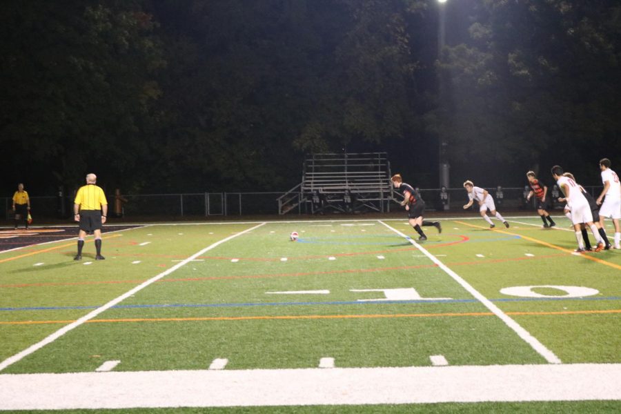 Senior Evan Rasmussen lines up to take a penalty kick.