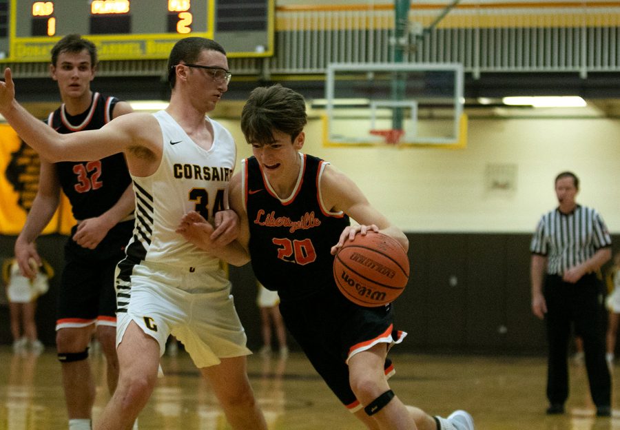 Junior Patrick Graham drives into the paint, not afraid to make contact with his defender.