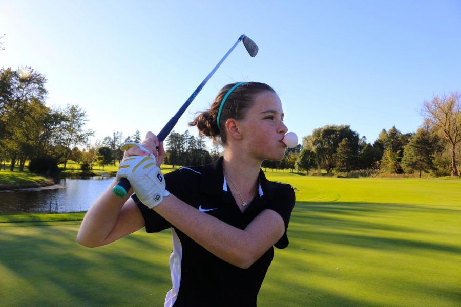 Payton DeBruler, a junior on the LHS Varsity golf team, has recently began the habit of chewing gum while she is playing.