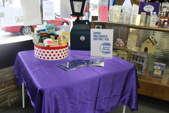 Free passports were given out to the shoppers to be stamped by each shop that they visited. They could then submit their passports into a raffle of the shop of their choosing. Petranek’s Pharmacy set up a small table near the entrance to display their raffle basket.