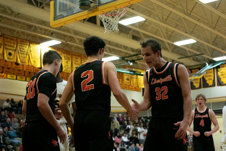 Drawing a clutch foul after a two-point layup late in the game, Wilterdink (2) had his teammates hyped up.