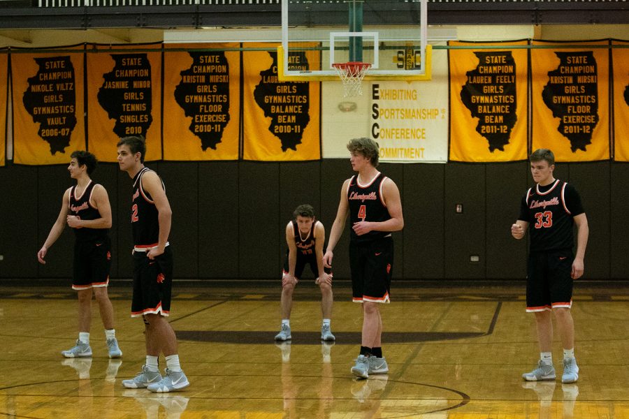 Ready to play their cross town rivals from just down the road, the starting five are all business in the final moments before tip-off.