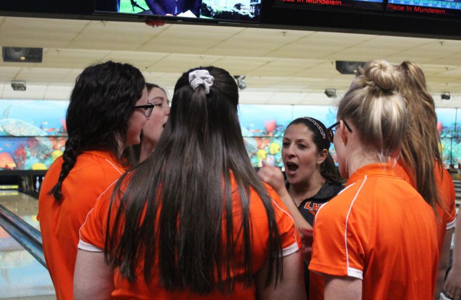 The bowling team huddles and chants before the match. Though Libertyville lost, they will have a chance to redeem themselves Jan. 23 when they play Warren again.