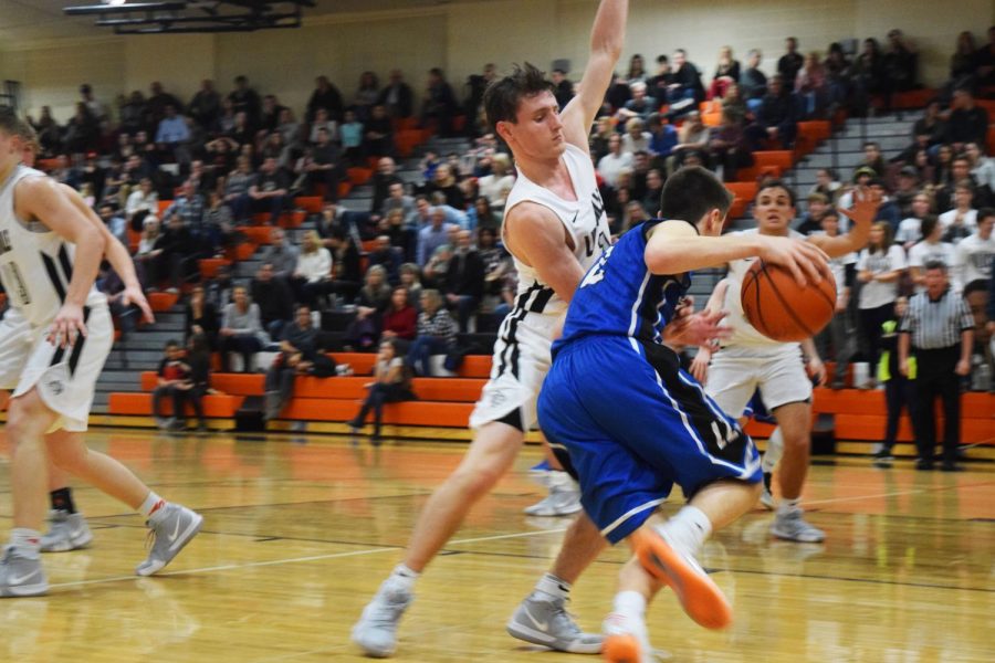 After Lake Zurich inbounded the ball, Steinhaus stays close to keep trying to gain possession of the ball.