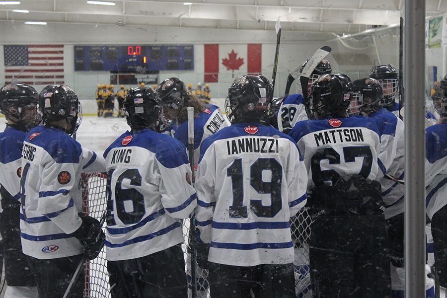 The Icecats gather before the game and have a brief talk.