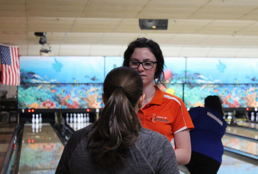 Coach Siegel advises junior and team captain Kylie Pacholski after she completed her frame.