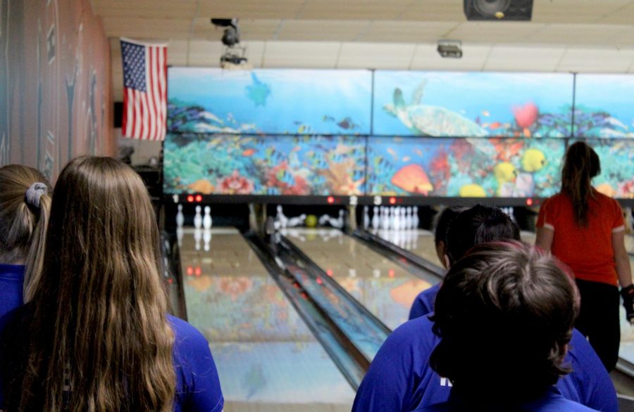 The Warren team watches as Felsl gets a strike during the first game. Libertyville won this game before losing the second two to their opponents, ultimately costing them the match.