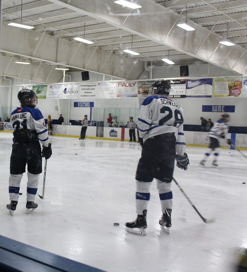 Two of the team’s LHS seniors, Kyle Junkunc and Payton Schweiger, chat before the game began.  